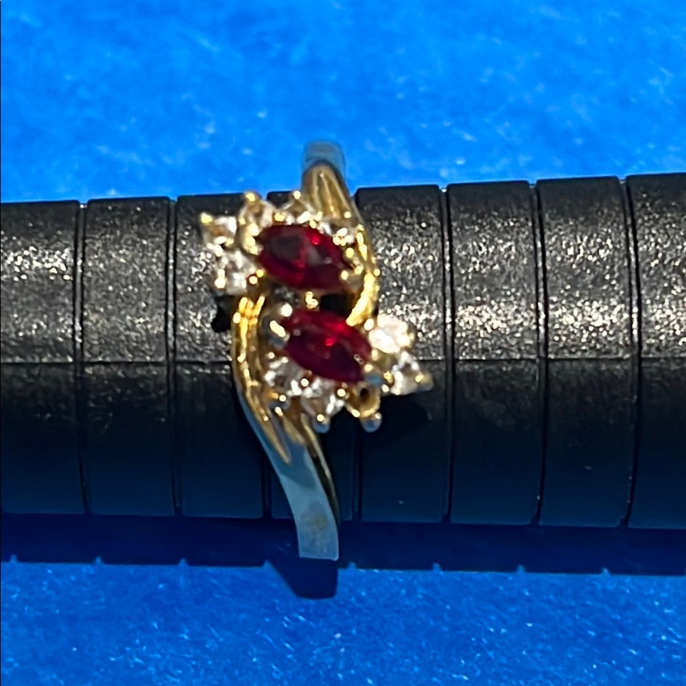 *Gold Ring with Red Gemstone and Diamond Halo